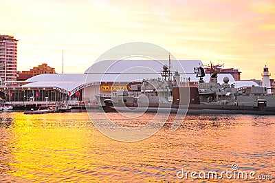 Battleship mooring at Australian National Maritime Museum with beautiful sunset sky. Editorial Stock Photo